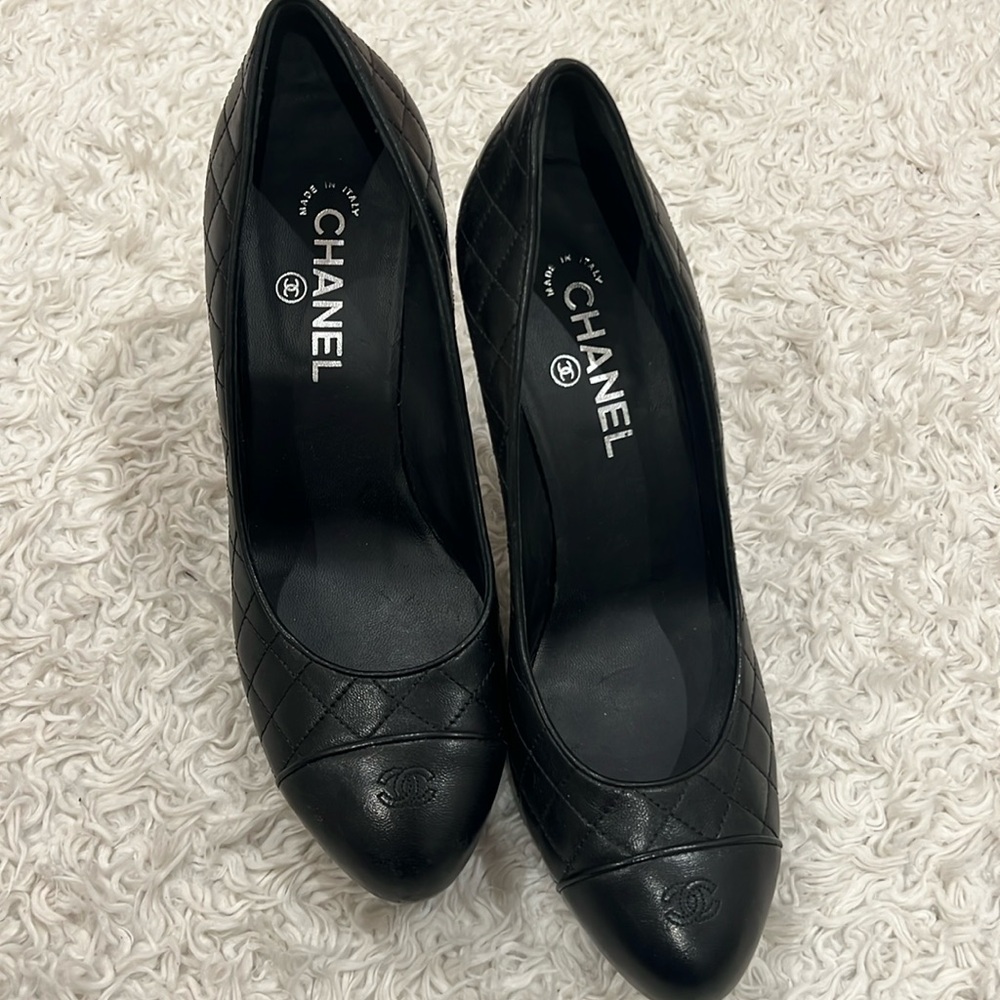Certified Authentic Chanel Black Leather pumps with proof of authenticity